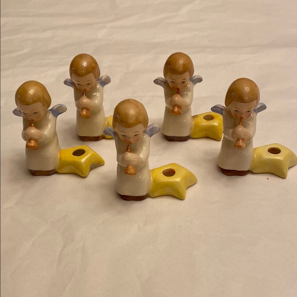 Goebel tiny Angels, 4 available. Holds a candle. Bidding on 1.